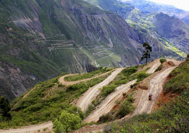 March: by Alberto Lara; of Naomi Tweddle, Canada. The road snakes down and then up in the Peruvian Highlands, on our Canada to Argentina tour; BMW F800GS.